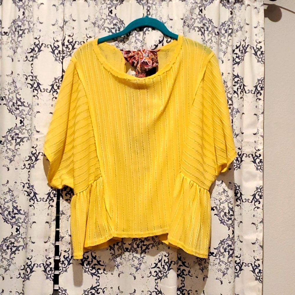 yellow flowy top with bow